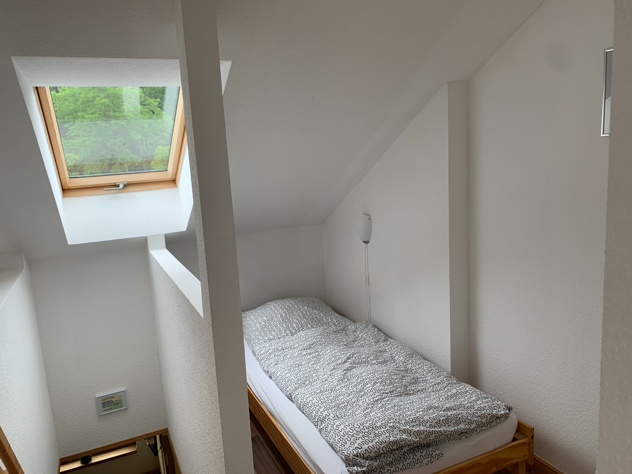 Separate single bed in the basic triple room