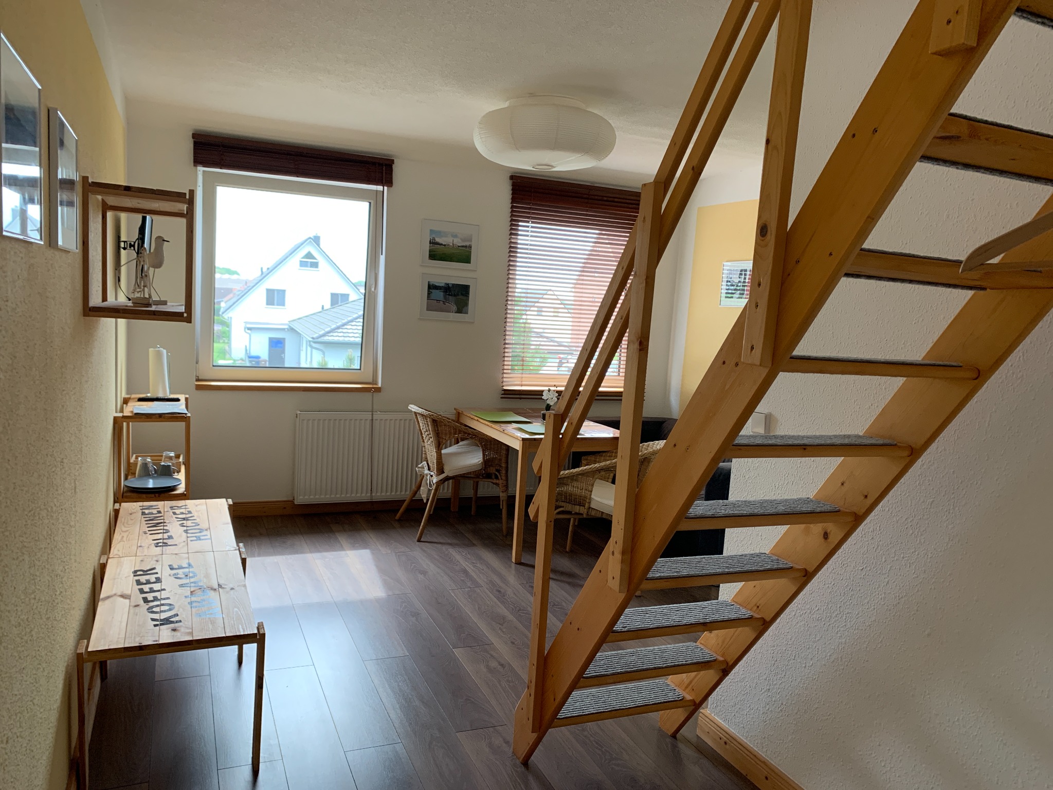Living and dining area with staircase